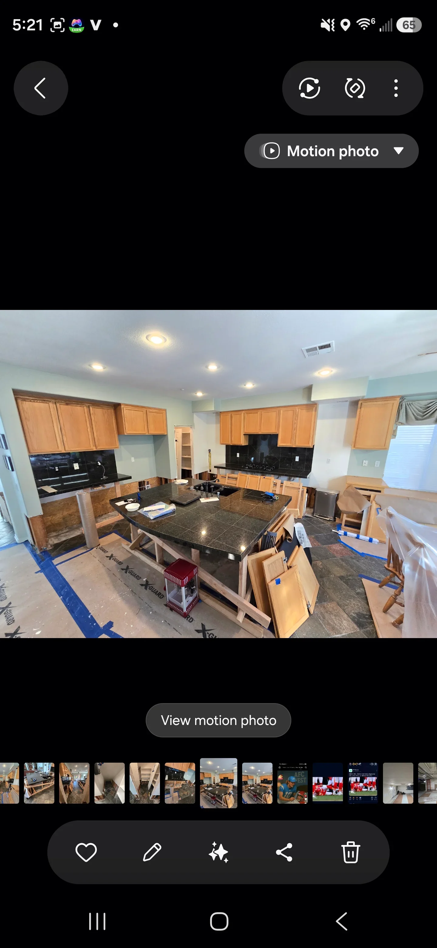 Kitchen with wood cabinetry, granite countertops, black backsplash, and recessed lighting during renovation